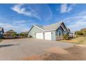 A detached three car garage with an extra-long driveway and lots of parking at 18934 E Happy Rd, Queen Creek, AZ 85142