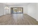 Open living room with tile floors and sliding glass doors, offering plenty of natural light at 20075 E Kestrel St, Queen Creek, AZ 85142