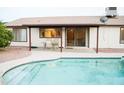 Inviting backyard featuring a refreshing swimming pool and covered patio area at 2738 E Libby St, Phoenix, AZ 85032