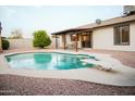 Inviting backyard featuring a refreshing swimming pool and diving board at 2738 E Libby St, Phoenix, AZ 85032