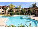 Resort-style pool and spa surrounded by lush landscaping and comfortable lounge chairs for relaxation and enjoyment at 3330 S Gilbert Rd # 1003, Chandler, AZ 85286