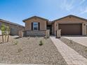 Attractive single-story home with desert landscaping and a two-car garage at 4819 N 177Th Ln, Goodyear, AZ 85395
