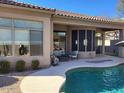 Back patio with a view of the pool and desert landscaping, perfect for outdoor entertaining at 34687 N 93Rd Pl, Scottsdale, AZ 85262