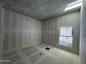 Bright bedroom under construction featuring a large window and drywall at 4309 E Brook Lynn Pl, San Tan Valley, AZ 85143