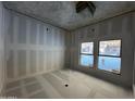 Bright bedroom under construction featuring large windows and a neutral color palette at 4309 E Brook Lynn Pl, San Tan Valley, AZ 85143