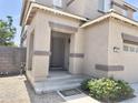Inviting covered front porch with decorative pillars and a cozy 'welcome' mat at 1237 E Marcella Ln, Gilbert, AZ 85295