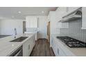 Bright kitchen featuring white cabinetry, stainless appliances, and a large island at 11996 N Luckenbach St, Surprise, AZ 85388