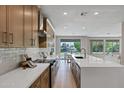 Beautiful open concept kitchen with island seating and lovely backyard views at 175 N Brookside St, Chandler, AZ 85225