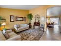 Cozy room features neutral furniture, decorative accessories, and an arched doorway leading to the living room at 17500 N 85Th Dr, Peoria, AZ 85382