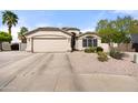 Charming single-story home with a two-car garage and desert landscaping at 20017 N 65Th Dr, Glendale, AZ 85308