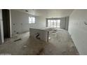 A large living room interior with drywall, a sink, and a large window at 2385 E Spur Dr, San Tan Valley, AZ 85140