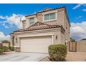 Side view of the house with a two-car garage, beige stucco, and stone accents at 30878 W Picadilly Rd, Buckeye, AZ 85396