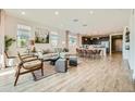 Bright living space featuring an open layout connected to the kitchen, with modern furniture and natural light at 3347 E Outlaw Ln, San Tan Valley, AZ 85140