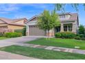 Single-Gathering home boasting a well-manicured lawn and a convenient two-car garage at 3504 E Pinto Dr, Gilbert, AZ 85296