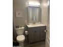 Bathroom features gray vanity, white countertops, modern fixtures, and neutral paint at 4242 N 27Th St # 2, Phoenix, AZ 85016