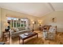 Bright living room with hardwood floors, large window, and comfortable seating arrangement next to the dining area at 4800 N 68Th St # 270, Scottsdale, AZ 85251