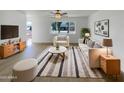 Bright living room featuring contemporary furniture, stylish decor, and a large window at 492 W 17Th Ave, Apache Junction, AZ 85120