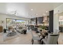 Open-concept living room and kitchen with modern furnishings and a view of the outdoors at 6522 E Night Glow Cir, Scottsdale, AZ 85266
