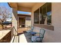Inviting front porch with seating area, perfect for enjoying the outdoors at 690 W Mangrove Rd, Queen Creek, AZ 85140