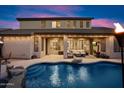Backyard pool and patio showcasing a perfect outdoor space for relaxation and entertainment at 7238 W El Cortez Pl, Peoria, AZ 85383