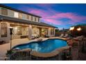 Backyard pool with rock waterfall and spacious patio area perfect for outdoor entertainment at 7238 W El Cortez Pl, Peoria, AZ 85383