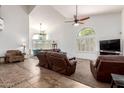 Bright living room with high ceilings, large windows, tile entry, and comfortable seating at 844 W Sherri Dr, Gilbert, AZ 85233