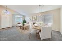 Bright, open-concept living and dining area with neutral decor and ample natural light at 12333 W Marshall Ave, Litchfield Park, AZ 85340