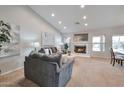 Inviting living room boasts a fireplace, recessed lighting, and a cozy atmosphere at 15834 W Avalon Dr, Goodyear, AZ 85395