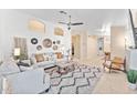 Open-concept living room features shiplap accent wall, neutral decor, and an inviting atmosphere at 16823 S 8Th St, Phoenix, AZ 85048