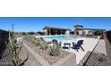 Relaxing pool area featuring comfortable lounge seating, desert landscaping, and clear, refreshing water at 19360 N Diego Way, Maricopa, AZ 85138
