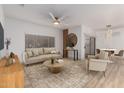 Comfortable living room with neutral tones, modern furniture, and ample natural light at 20301 N Queen Palm Ln, Surprise, AZ 85374