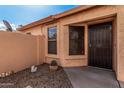 Entry area showcasing a secure front door and desert landscaping at 21819 N 48Th St, Phoenix, AZ 85054