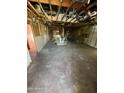 Unfinished interior with exposed studs and beams in a home undergoing renovation at 2230 N Laurel Ave, Phoenix, AZ 85007