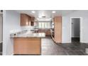Spacious kitchen boasts tile flooring, updated countertops, and functional layout at 2816 S Don Luis Cir, Mesa, AZ 85202