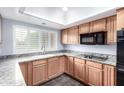 Modern kitchen features updated appliances, granite countertops, and ample cabinet space at 2816 S Don Luis Cir, Mesa, AZ 85202