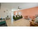 Inviting living room with tile flooring, complemented by stylish furniture and ample natural light at 3413 W Ocotillo Rd, Phoenix, AZ 85017
