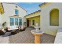 Inviting outdoor courtyard with a fountain, comfortable seating, and stylish decor at 3842 E Fountain St, Mesa, AZ 85205