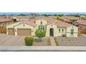 Charming home with a tile roof, well-manicured landscaping, and a two-car garage at 3842 E Fountain St, Mesa, AZ 85205