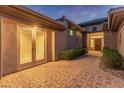 Covered patio with a paver floor and access to the home's interior at 41424 N Club Pointe Dr, Anthem, AZ 85086