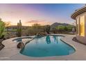 Backyard swimming pool and spa with desert views at 41424 N Club Pointe Dr, Anthem, AZ 85086