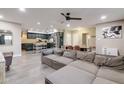 Spacious open-concept living room flows into a kitchen and dining area with modern decor and neutral tones at 4527 N 12Th Ave, Phoenix, AZ 85013
