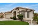 Inviting home with desert landscaping, a two-car garage, and a covered entry, offering curb appeal and convenience at 628 N El Dorado Dr, Gilbert, AZ 85233