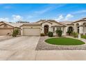 Beautiful home featuring a desert-style landscaped yard, a two-car garage, and a well-maintained exterior at 628 N El Dorado Dr, Gilbert, AZ 85233