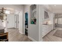 Bright kitchen features white cabinets, stainless appliances, and modern finishes at 6916 E Trailridge Cir, Mesa, AZ 85207