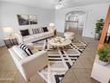 Bright living room featuring modern decor, stylish furniture, and a decorative rug at 7334 W Comet Ave, Peoria, AZ 85345