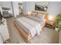 Comfortable main bedroom showcasing a wooden bed frame and tasteful decor at 7334 W Comet Ave, Peoria, AZ 85345