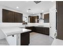 Modern kitchen featuring stainless steel appliances, dark wood cabinets and elegant counter tops at 8240 E Quintuplet Ave, Mesa, AZ 85212