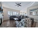 Spacious living room with a ceiling fan, ample seating, and seamless transition to the dining area at 8245 E Bell Rd # 133, Scottsdale, AZ 85260