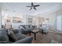 Comfortable living room featuring a ceiling fan and seamless open-concept design to the kitchen at 8245 E Bell Rd # 133, Scottsdale, AZ 85260