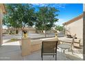 Relaxing front patio with chairs and views of a well-maintained street at 10960 E Monte Ave # 169, Mesa, AZ 85209